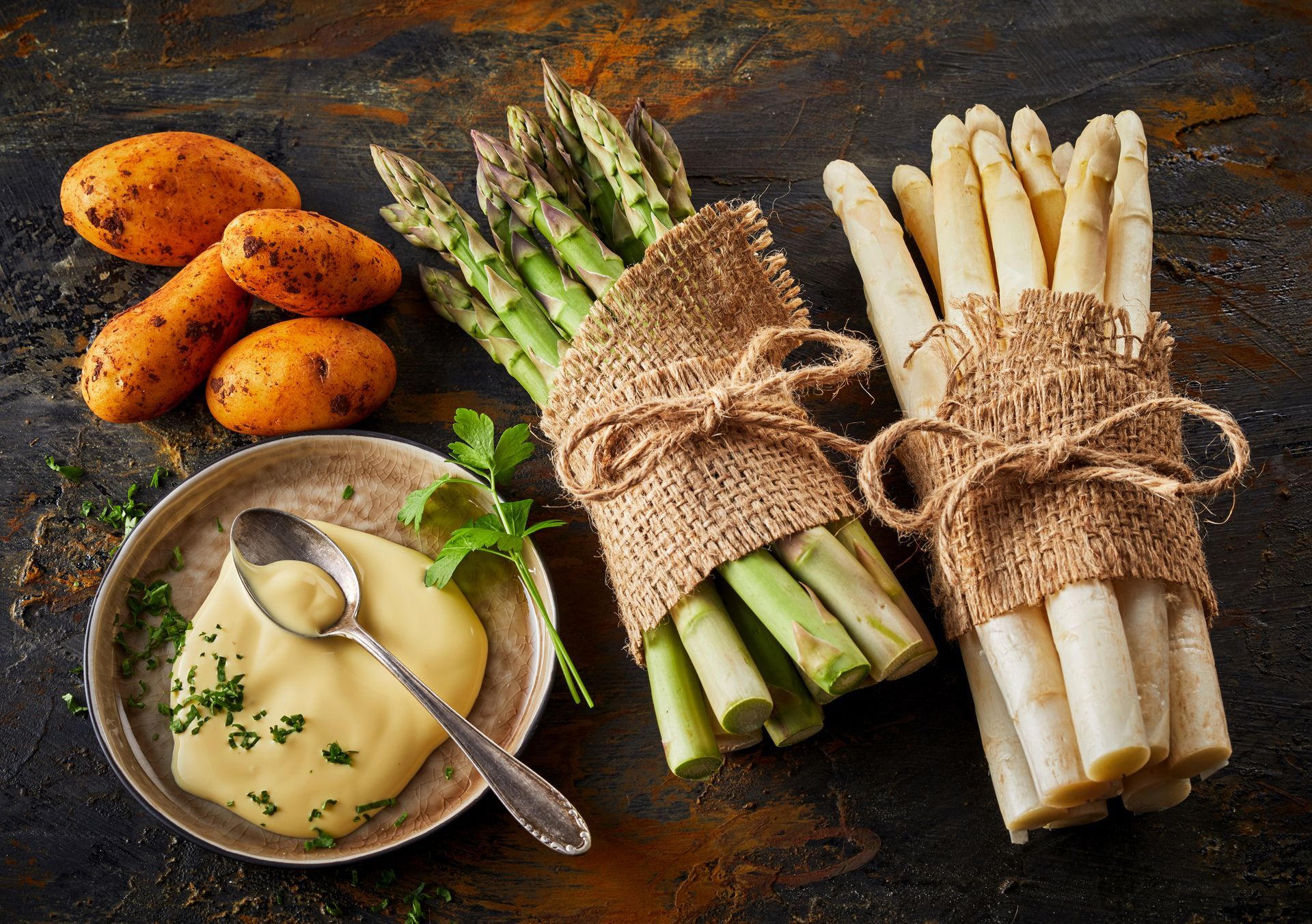 Fresh raw asparagus spears with mayonnaise