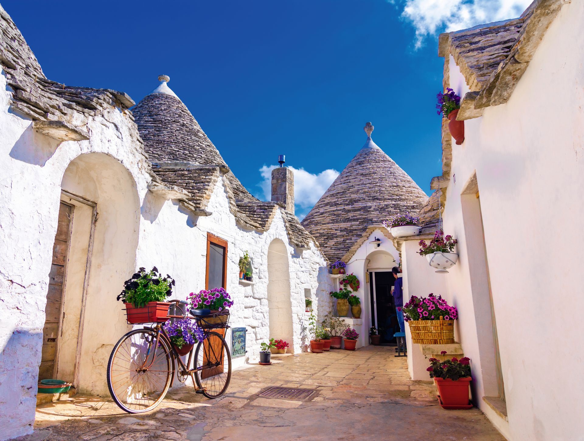 Alberobello, Puglia, Italy: Typical houses built with dry stone walls and conical roofs, in a beautiful day, Apulia