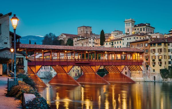 Bassano del Grappa, Italy - January 09, 2024: panorama of the Ponte degli Alpini in the evening