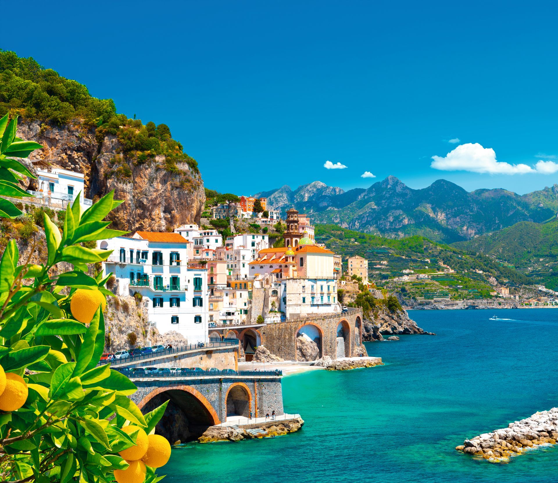 Beautiful view of Amalfi on the Mediterranean coast with lemons in the foreground, Italy. High quality photo